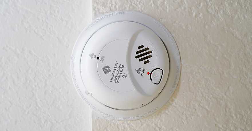 Image of a circular, white CO alarm